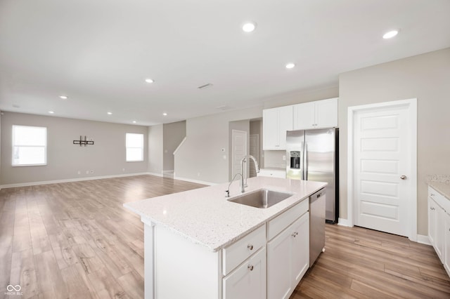 7510 Hillway Dr, Camby, IN 46113 - kitchen featuring appliances with stainless steel finishes, white cabinets, light wood-style flooring, and recessed lighting