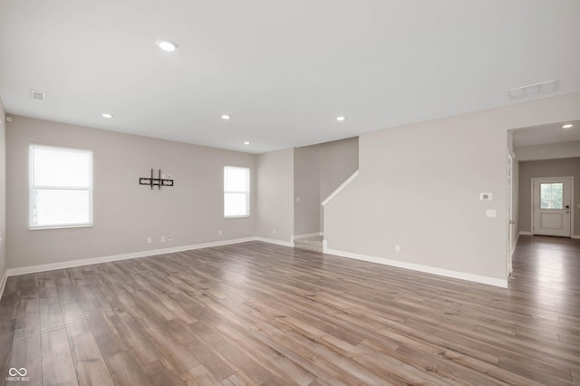 7510 Hillway Dr, Camby, IN 46113 - unfurnished living room with wood finished floors and recessed lighting