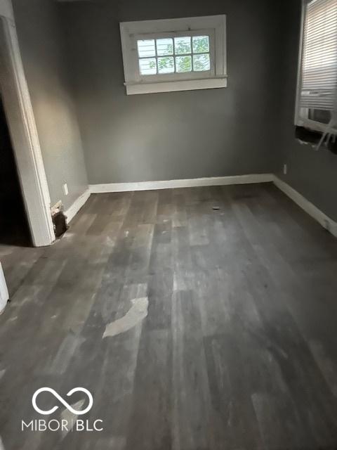 3701 E Vermont St, Indianapolis, IN 46201 - empty room featuring baseboards and wood finished floors