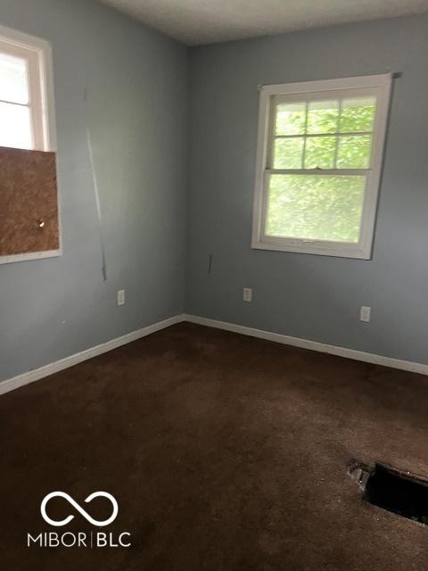3701 E Vermont St, Indianapolis, IN 46201 - spare room with dark carpet