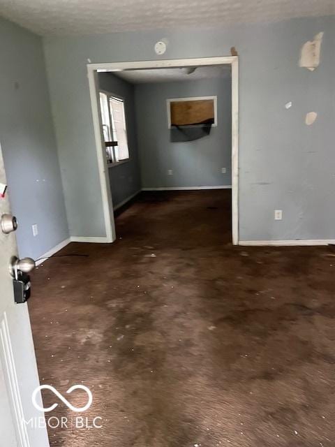3701 E Vermont St, Indianapolis, IN 46201 - unfurnished room with concrete flooring and a textured ceiling