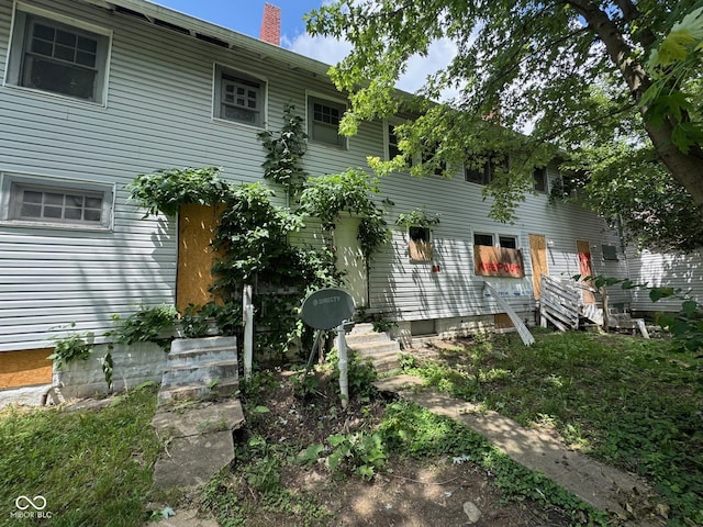 3701 E Vermont St, Indianapolis, IN 46201 - rear view of property with a chimney