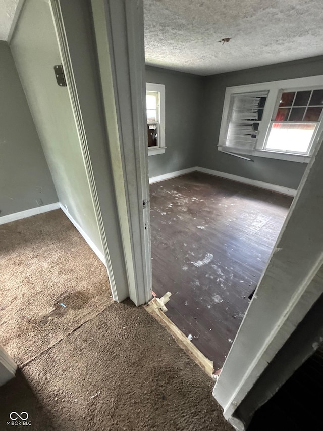 3701 E Vermont St, Indianapolis, IN 46201 - detailed view of baseboards and a textured ceiling