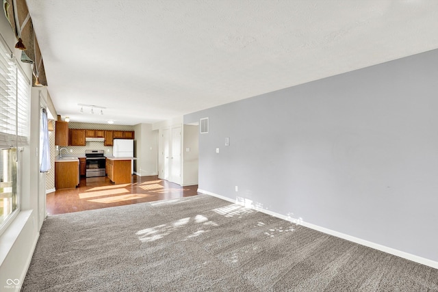 11961 Driftstone Dr, Fishers, IN 46037 - unfurnished living room featuring carpet flooring and baseboards