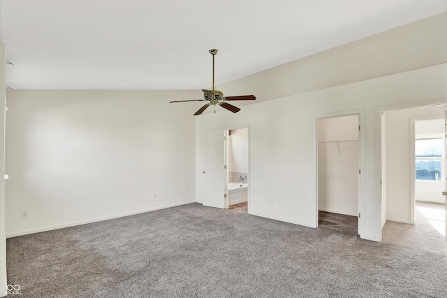 11961 Driftstone Dr, Fishers, IN 46037 - unfurnished bedroom featuring carpet floors, ensuite bath, a spacious closet, a closet, and vaulted ceiling