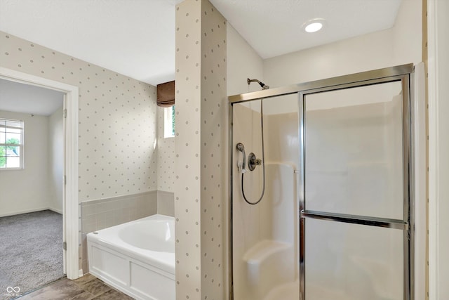 11961 Driftstone Dr, Fishers, IN 46037 - full bathroom with a shower stall, a bath, and wallpapered walls