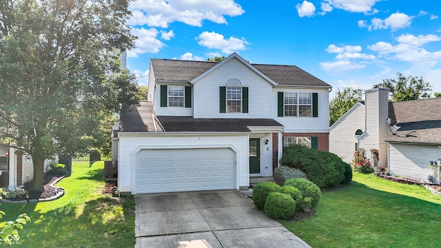 11961 Driftstone Dr, Fishers, IN 46037 - traditional-style house featuring driveway, an attached garage, and a front lawn