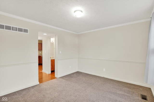 11961 Driftstone Dr, Fishers, IN 46037 - spare room featuring light colored carpet, crown molding, and a textured ceiling