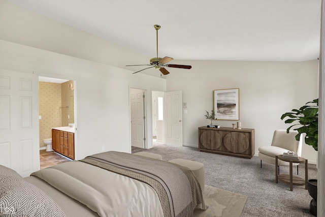 11961 Driftstone Dr, Fishers, IN 46037 - bedroom with light colored carpet, vaulted ceiling, ensuite bathroom, and ceiling fan