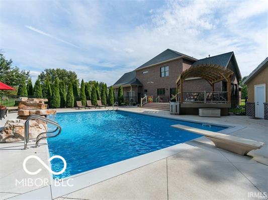 1130 Kingswood Rd S, West Lafayette, IN 47906 - view of swimming pool featuring a patio and a diving board