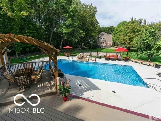 1130 Kingswood Rd S, West Lafayette, IN 47906 - view of pool featuring a patio area, view of scattered trees, and an outdoor hangout area