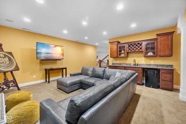 1130 Kingswood Rd S, West Lafayette, IN 47906 - living area with bar with sink, light carpet, recessed lighting, and stairway
