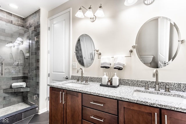 624 E Walnut St Unit 48, Indianapolis, IN 46204 - bathroom with double vanity, a shower stall, and tile patterned flooring
