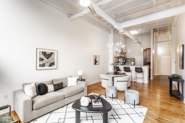 624 E Walnut St Unit 48, Indianapolis, IN 46204 - living area featuring a towering ceiling and light wood-type flooring