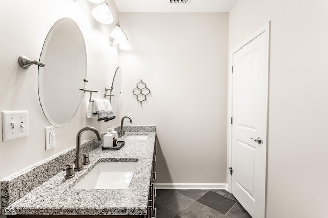 624 E Walnut St Unit 48, Indianapolis, IN 46204 - bathroom with double vanity and baseboards