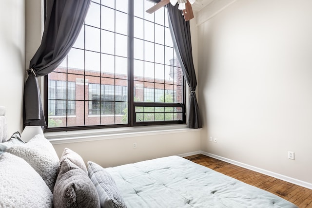624 E Walnut St Unit 48, Indianapolis, IN 46204 - bedroom with multiple windows and wood finished floors