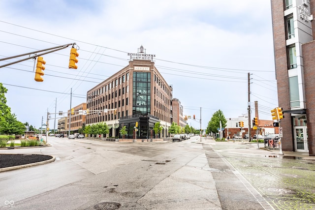 624 E Walnut St Unit 48, Indianapolis, IN 46204 - view of asphalt road featuring traffic lights, street lights, curbs, traffic signs, and sidewalks