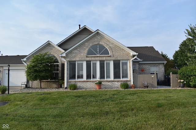 7357 Lake Lakota Dr, Indianapolis, IN 46217 - back of house with brick siding and a garage