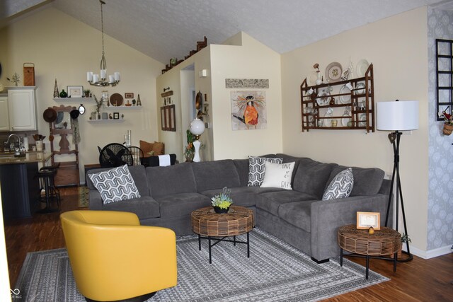 7357 Lake Lakota Dr, Indianapolis, IN 46217 - living area featuring dark wood-style floors, a chandelier, and vaulted ceiling
