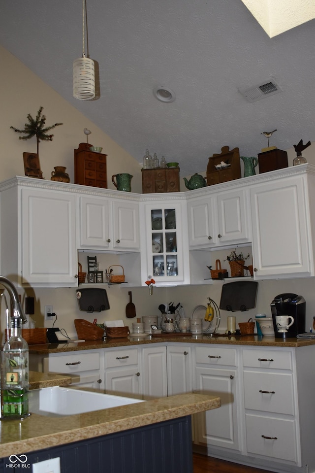 7357 Lake Lakota Dr, Indianapolis, IN 46217 - kitchen with white cabinetry, open shelves, and pendant lighting