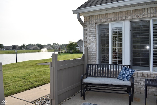 7357 Lake Lakota Dr, Indianapolis, IN 46217 - view of patio featuring a water view and a residential view