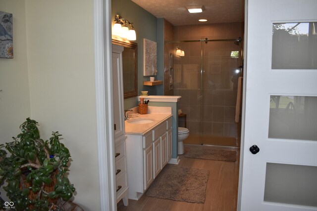 7357 Lake Lakota Dr, Indianapolis, IN 46217 - full bath with vanity, wood finished floors, and a stall shower