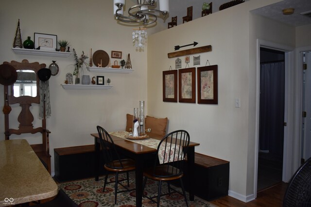 7357 Lake Lakota Dr, Indianapolis, IN 46217 - dining space featuring a chandelier and wood finished floors