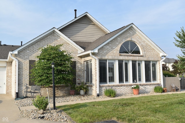 7357 Lake Lakota Dr, Indianapolis, IN 46217 - view of front of home featuring brick siding and roof with shingles