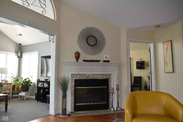 7357 Lake Lakota Dr, Indianapolis, IN 46217 - living area with a fireplace with flush hearth, wood finished floors, and lofted ceiling