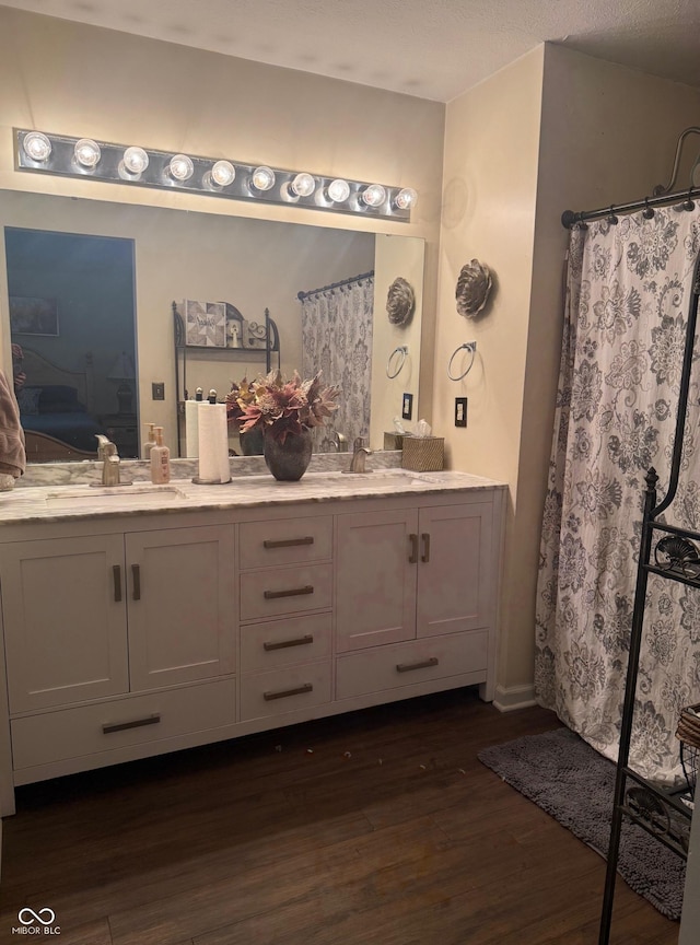 11632 Coastal Way, Indianapolis, IN 46229 - ensuite bathroom featuring double vanity and wood finished floors