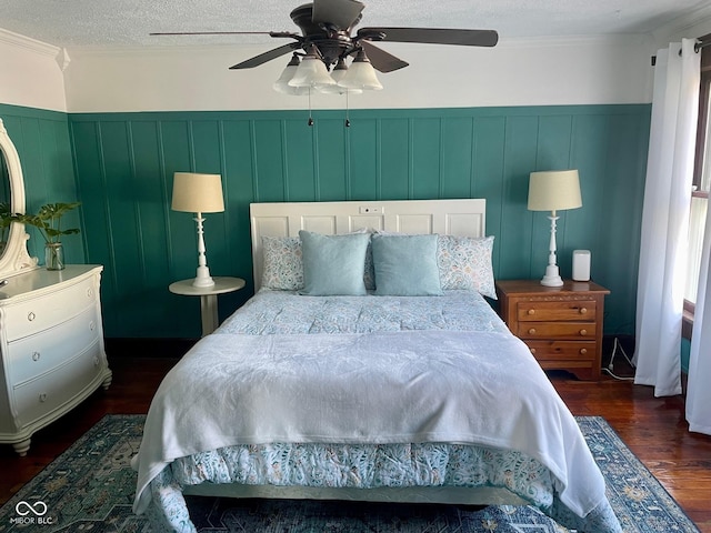 251 N St, Danville, IN 46122 - bedroom with dark wood-style floors, wainscoting, ceiling fan, a textured ceiling, and a decorative wall