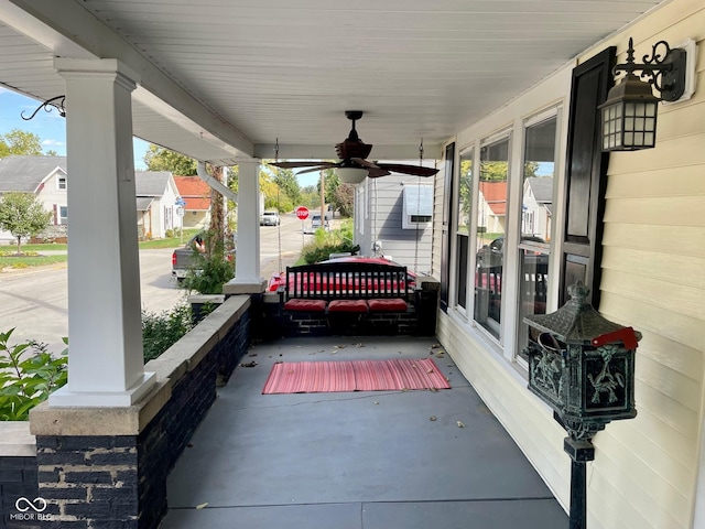 251 N St, Danville, IN 46122 - porch featuring ceiling fan and a residential view