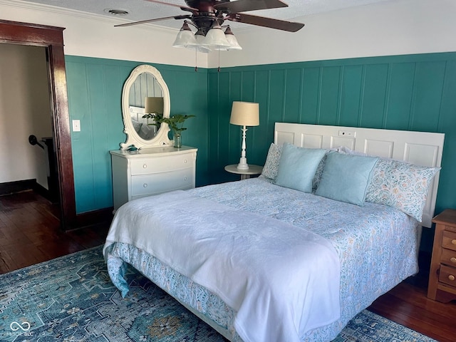 251 N St, Danville, IN 46122 - bedroom featuring hardwood / wood-style flooring, a decorative wall, ceiling fan, and wainscoting