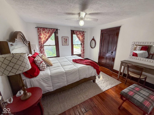 251 N St, Danville, IN 46122 - bedroom featuring wood finished floors, a textured ceiling, and a ceiling fan