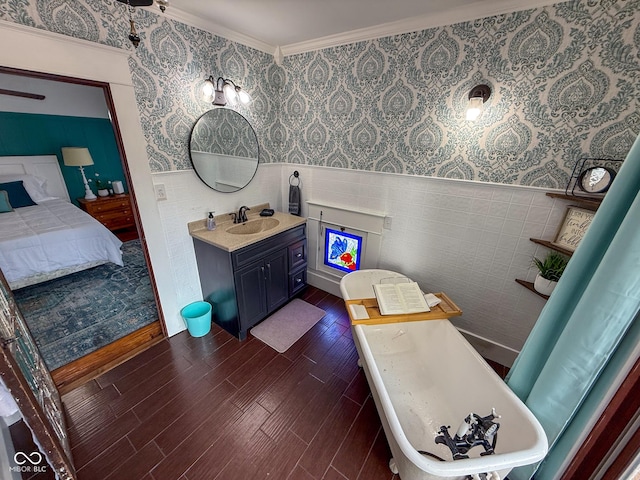 251 N St, Danville, IN 46122 - full bathroom featuring wallpapered walls, wainscoting, vanity, a freestanding bath, and crown molding