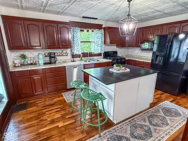 251 N St, Danville, IN 46122 - kitchen featuring black appliances, an ornate ceiling, tasteful backsplash, a chandelier, and decorative light fixtures