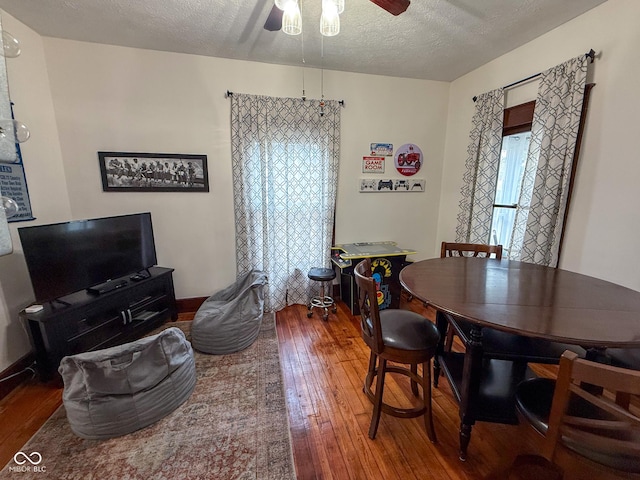 251 N St, Danville, IN 46122 - dining room featuring hardwood / wood-style floors, a ceiling fan, and a textured ceiling