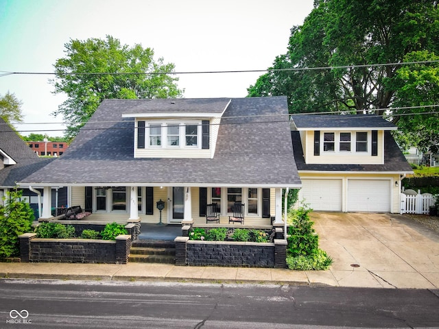 251 N St, Danville, IN 46122 - view of front of house with driveway, covered porch, an attached garage, and roof with shingles