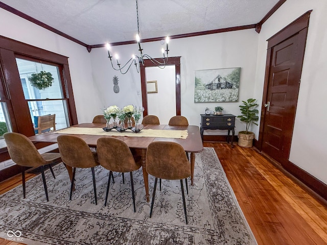 251 N St, Danville, IN 46122 - dining room with a chandelier, a textured ceiling, ornamental molding, and wood finished floors