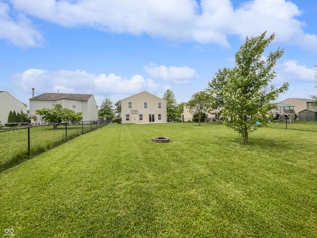 3445 Brandenburg Blvd, Indianapolis, IN 46239 - view of yard featuring an outdoor fire pit and a residential view
