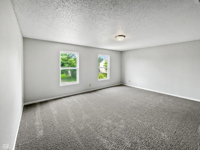3445 Brandenburg Blvd, Indianapolis, IN 46239 - spare room featuring a textured ceiling and carpet floors
