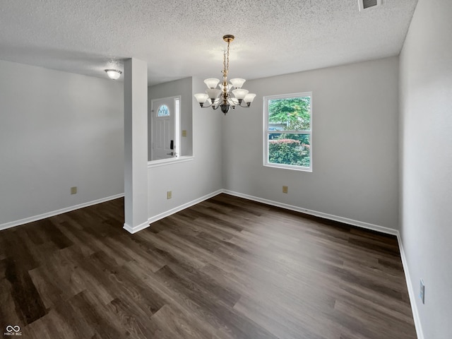 3445 Brandenburg Blvd, Indianapolis, IN 46239 - unfurnished room with a chandelier, a textured ceiling, and dark wood-style floors