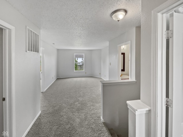 3445 Brandenburg Blvd, Indianapolis, IN 46239 - empty room featuring carpet floors and a textured ceiling