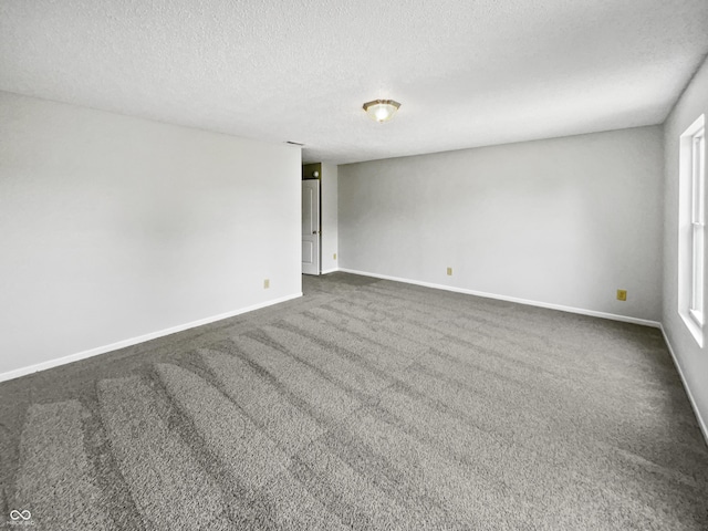 3445 Brandenburg Blvd, Indianapolis, IN 46239 - empty room with a textured ceiling and dark carpet