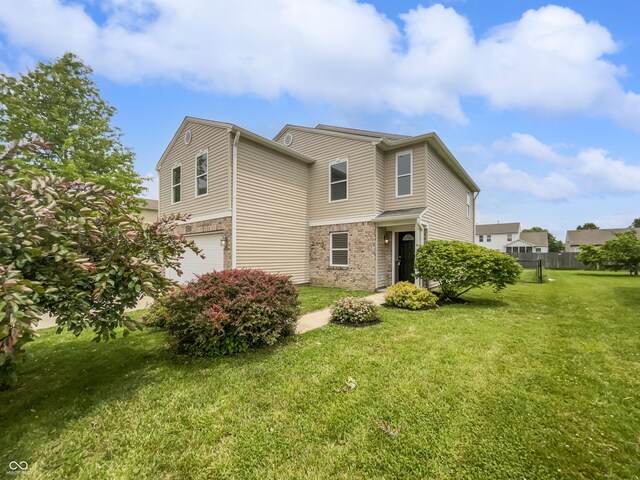 3445 Brandenburg Blvd, Indianapolis, IN 46239 - rear view of house with a garage and stone siding