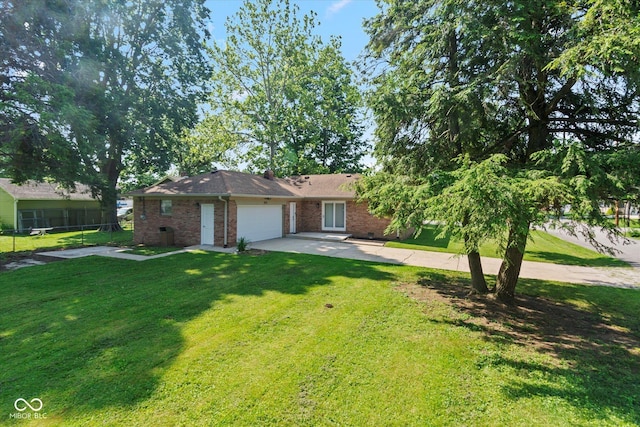802 Lawrence Ave, Indianapolis, IN 46227 - ranch-style house featuring an attached garage, brick siding, and driveway