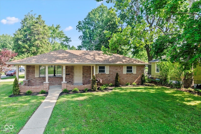 802 Lawrence Ave, Indianapolis, IN 46227 - ranch-style house with brick siding, a front yard, covered porch, and a shingled roof