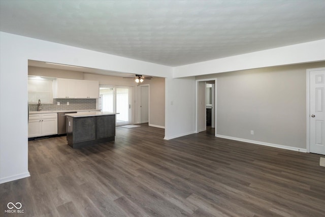 802 Lawrence Ave, Indianapolis, IN 46227 - unfurnished living room featuring dark wood-style flooring and a ceiling fan