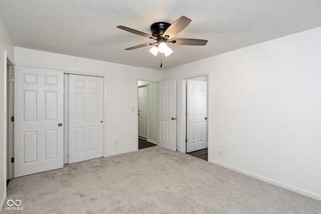 802 Lawrence Ave, Indianapolis, IN 46227 - unfurnished bedroom with carpet floors, a closet, and a ceiling fan