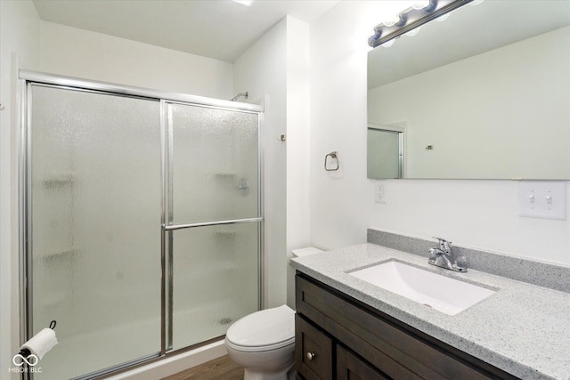 802 Lawrence Ave, Indianapolis, IN 46227 - full bath featuring vanity, a shower stall, and wood finished floors